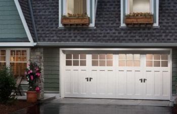 Residential house with double garage with new door.