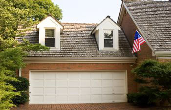 A double garagewith white door at a residential house.