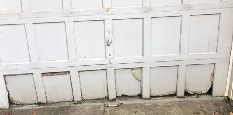 water damaged garage door panel replacement