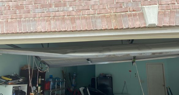 Damaged garage door panels, hit by car | Snellville, GA