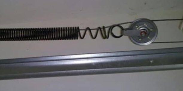 stretched and worn out extension spring on Sandy Springs garage door | Sandy Springs, GA