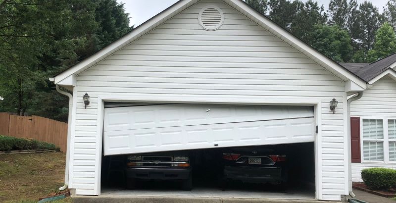 Fixing and off track garage door in Stone Mountain