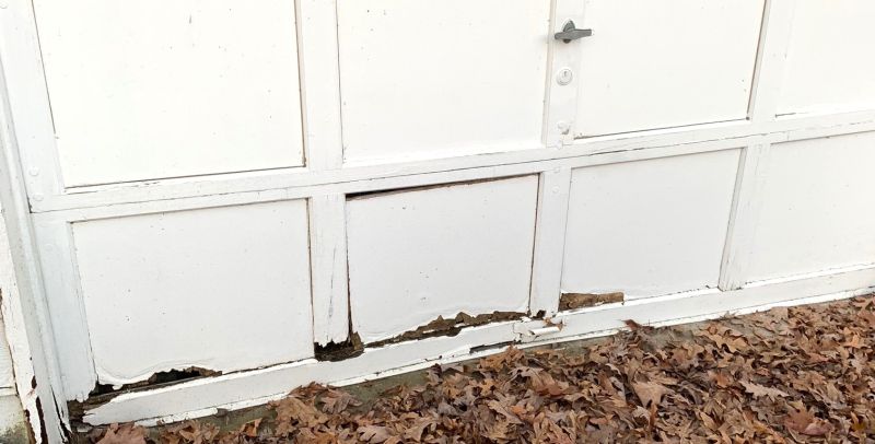 water damaged garage door panel replacement