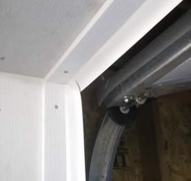weather stripping seal on header and jamb