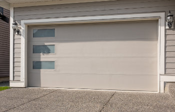 wide garage door and concrete driveway
